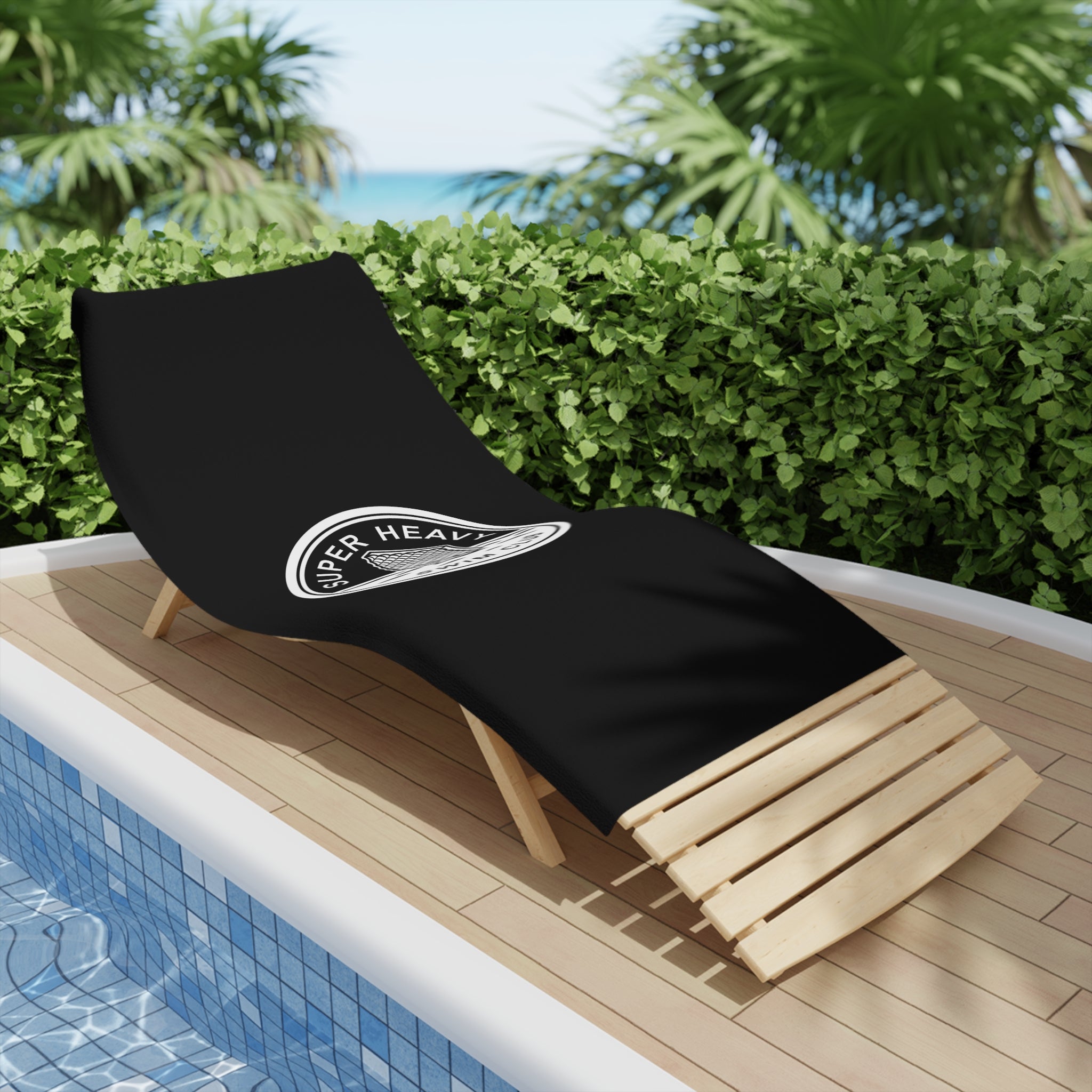 SpaceX Super Heavy booster-inspired beach towel, playful swim club design, laying on a beach chair.